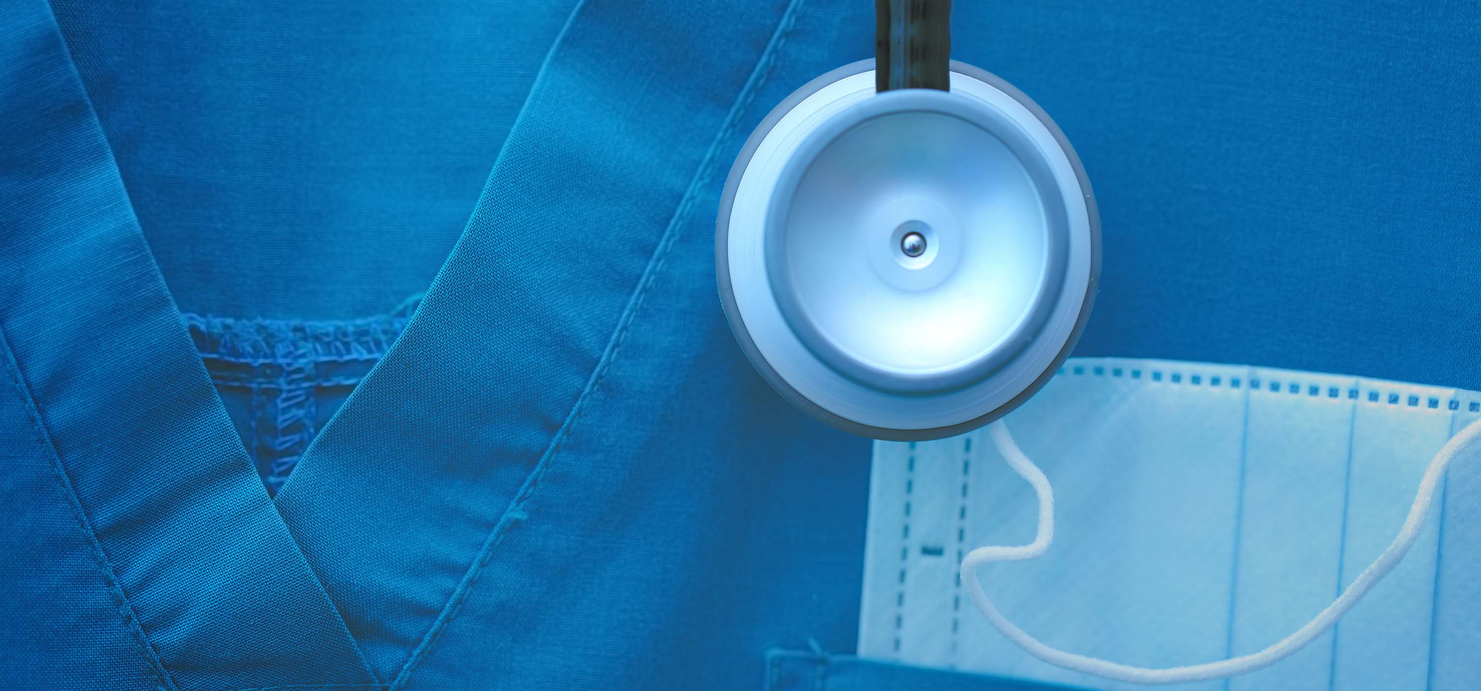 A stethoscope and medical scrub.