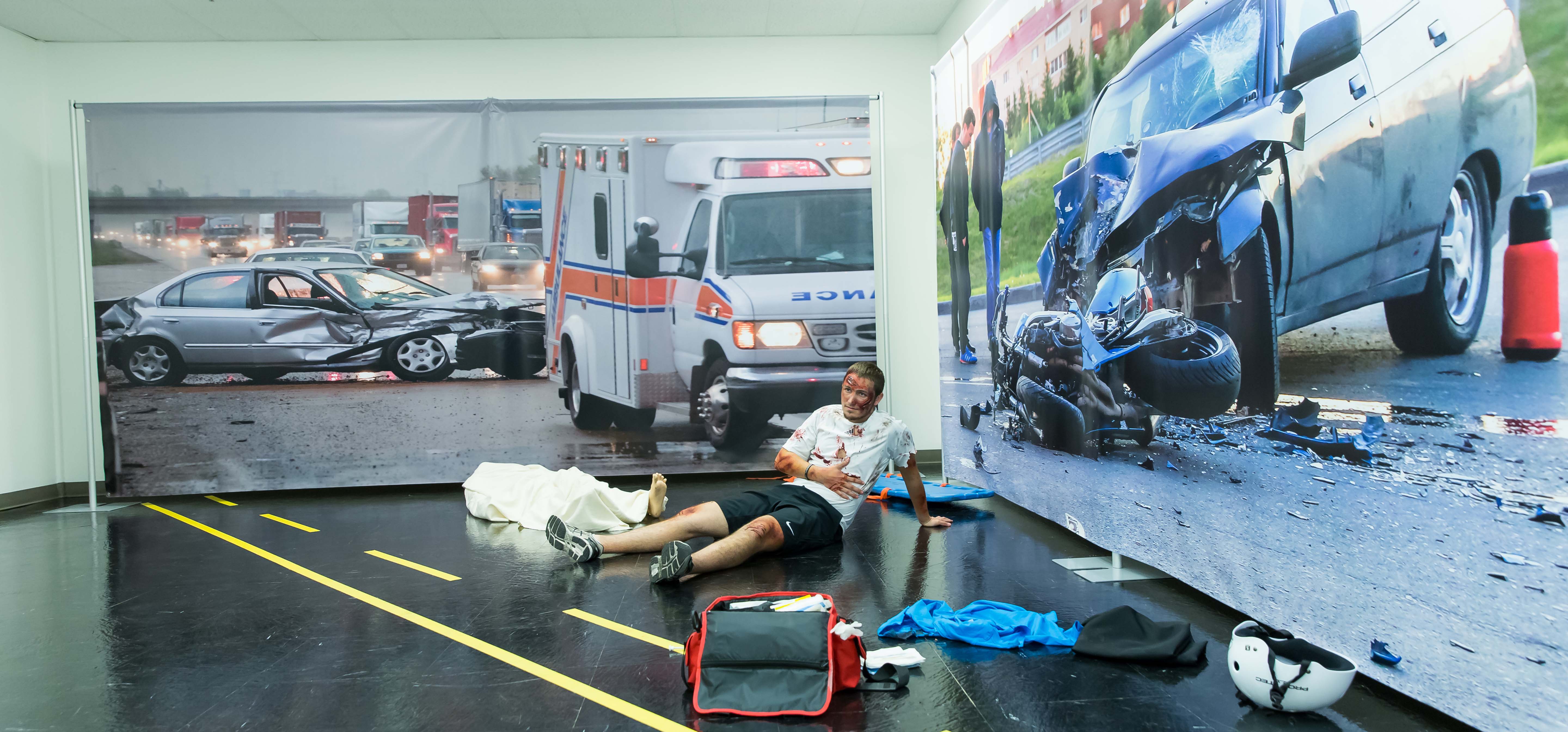 A simulated patient on the floor.