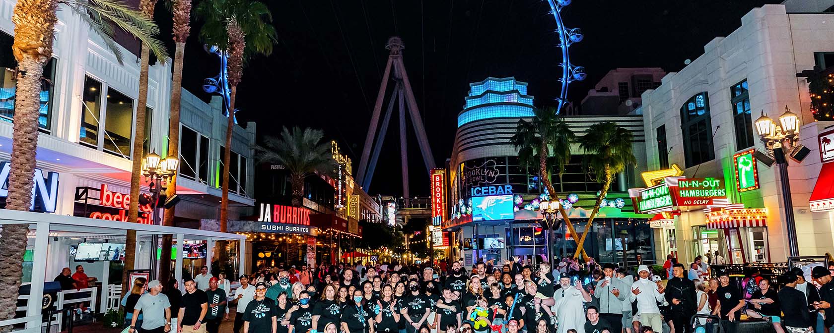 Our CADD families gathered in front of the High Roller wheel, lit up blue for the event.