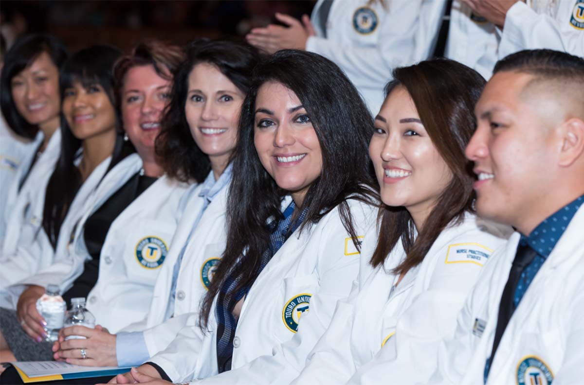 Students at a white coat ceremony.